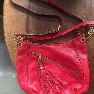 Michael Kors Red Crossbody Bag with Decorative Tassel and Gold Hardware